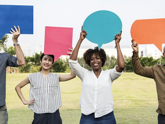 people holding talk bubbles