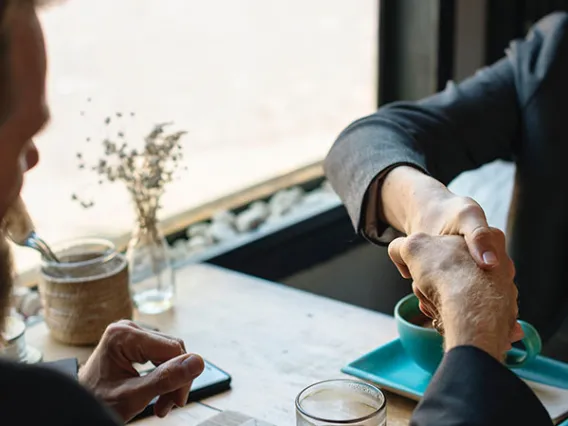 man and woman shaking hands