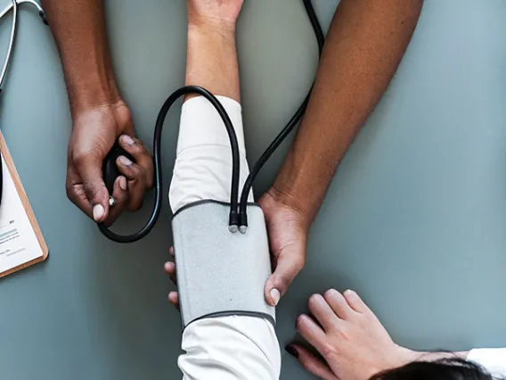 person having blood pressure taken