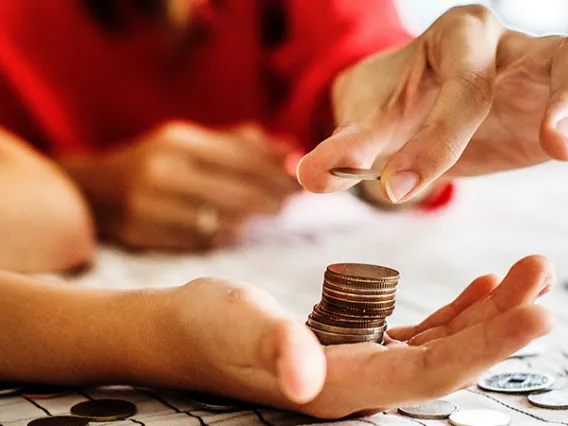 hand holding coins