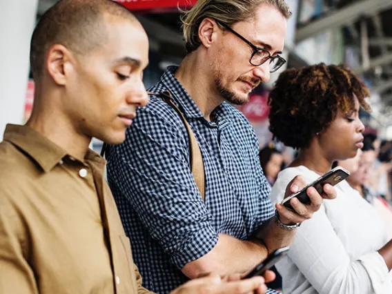 people looking at phones