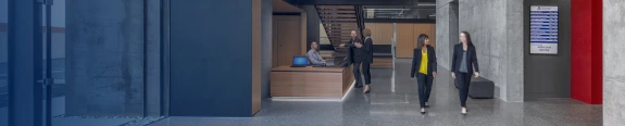 women walking in front of reception