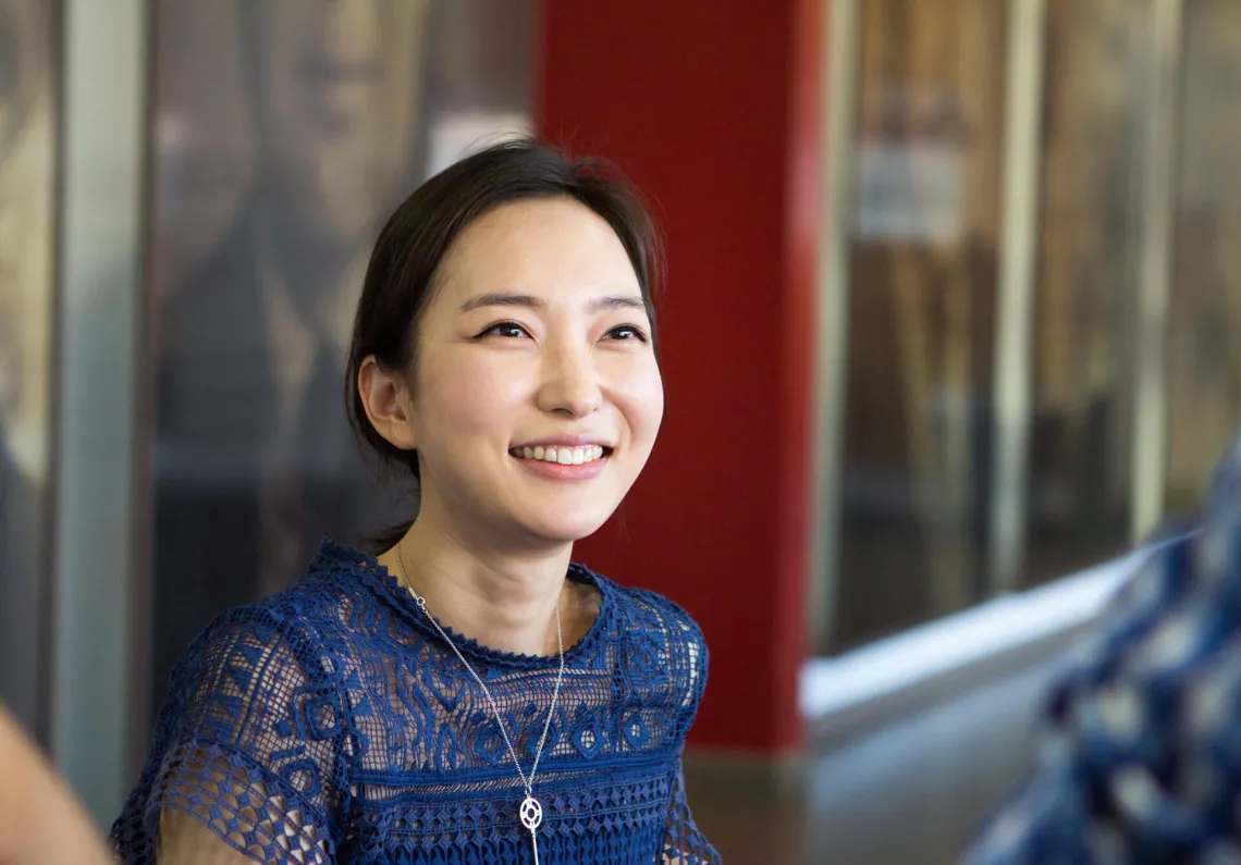 woman smiling with a blue shirt