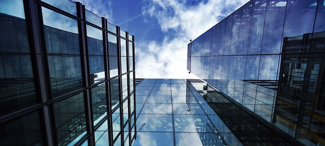 sky reflecting in buildings