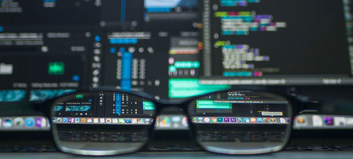 glasses in front of computer screen