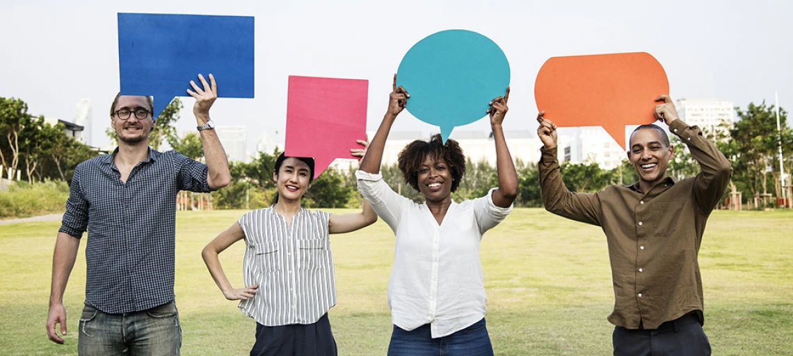 people holding talk bubbles