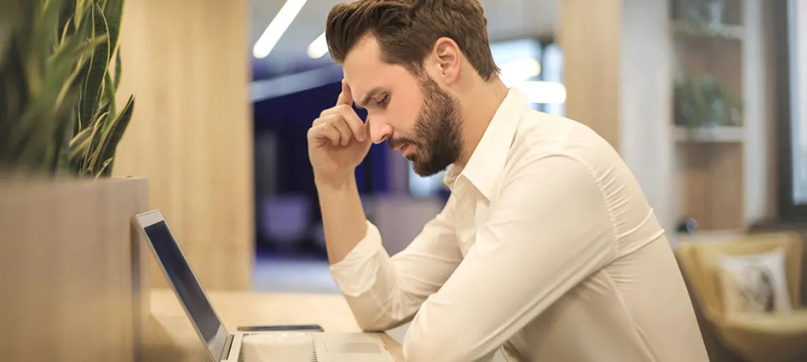 confused man with computer