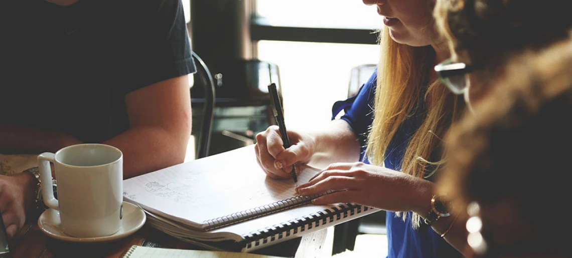 Woman writing in notebook