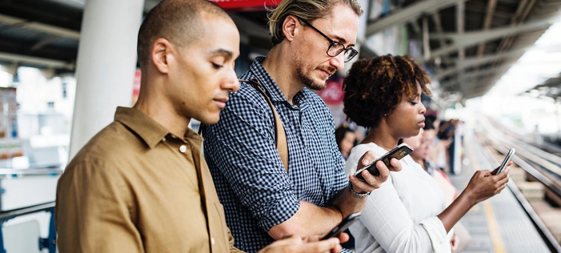 people looking at phones