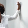 woman writing on whiteboard